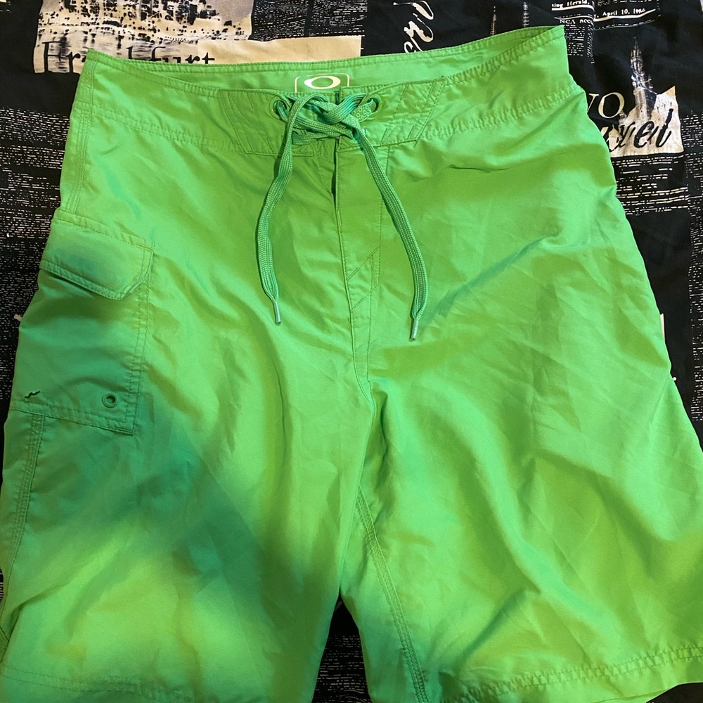 Green Oakley swim trunks sz: small waist : 30